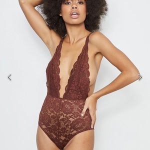 Unopened, unworn, NWT sexy bodysuit made with recycled lace.